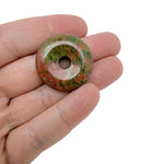 Colorful 30mm Crystal Donut Pi Stone gift from GemstoneGO featuring a mixed gemstone design with a polished, decorative appearance.