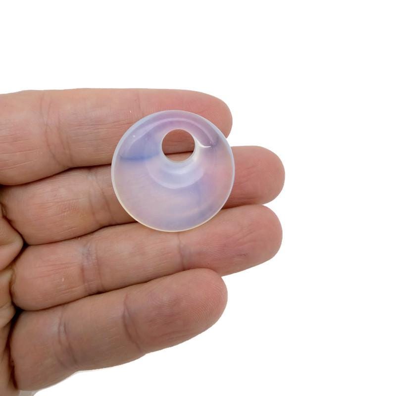 Polished 30mm Pi Stone healing crystal donut from GemstoneGO, featuring a vibrant mix of polished crystal and gemstone colors.