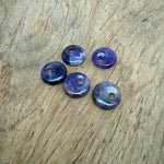 Amethyst crystal donut pendant from GemstoneGO, 20mm Pi stone with purple amethyst gemstone and polished smooth surface.