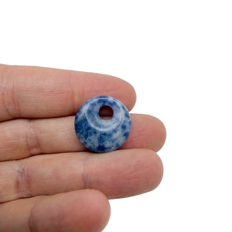 Blue sodalite crystal donut pendant, 20mm Pi Stone from GemstoneGO, polished gemstone with natural blue and white patterns.