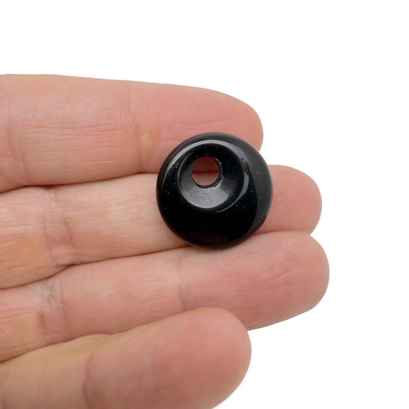 Polished 20mm obsidian crystal donut pendant with natural black and glossy finish, showcasing a smooth, rounded Pi stone shape.