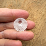 Clear Quartz Crystal Donut from GemstoneGO, 20mm Pi Stone with polished surface and circular shape for healing and meditation use.
