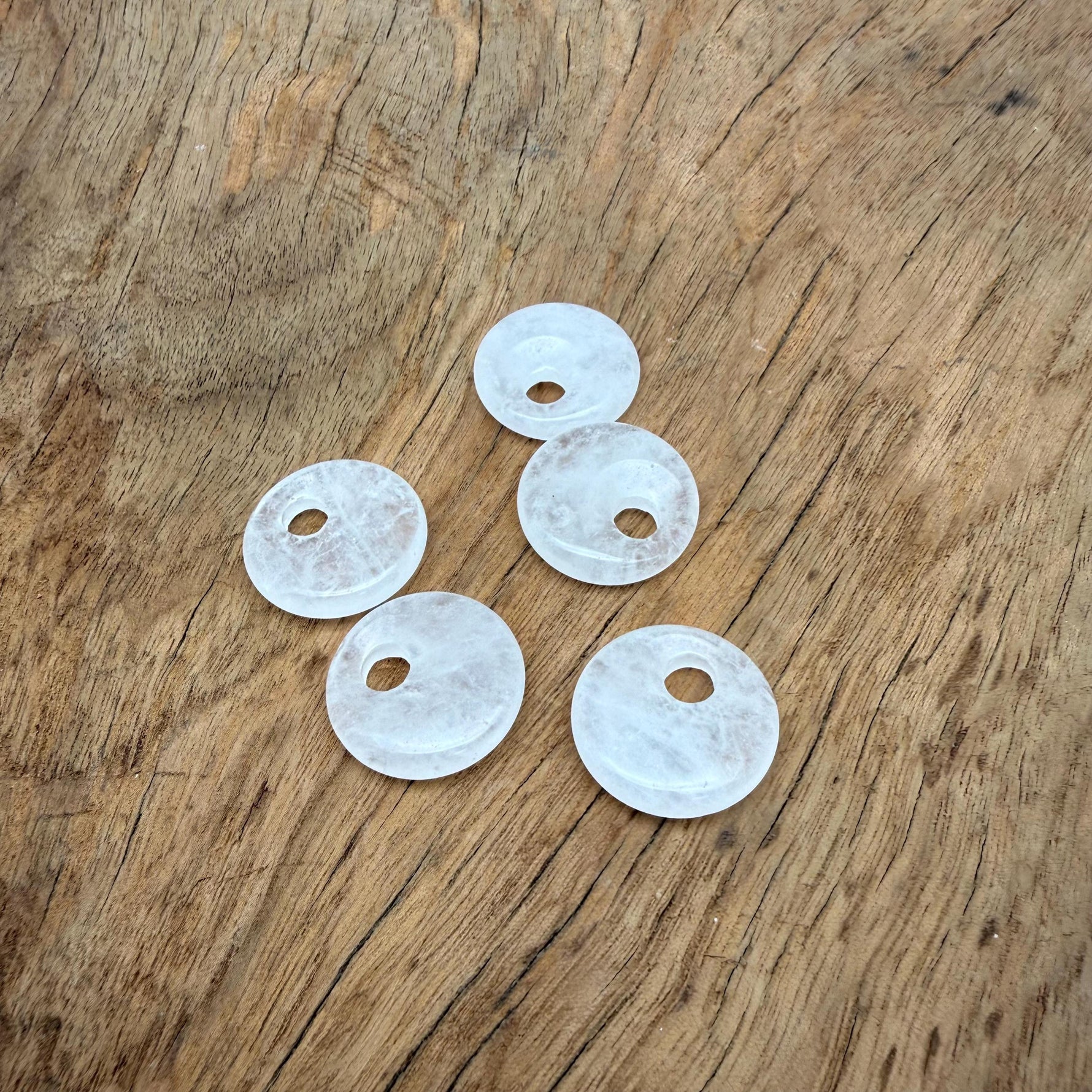 Clear Quartz Crystal Donut pendant from GemstoneGO, 20mm Pi Stone with a polished, translucent appearance and smooth, rounded shape.
