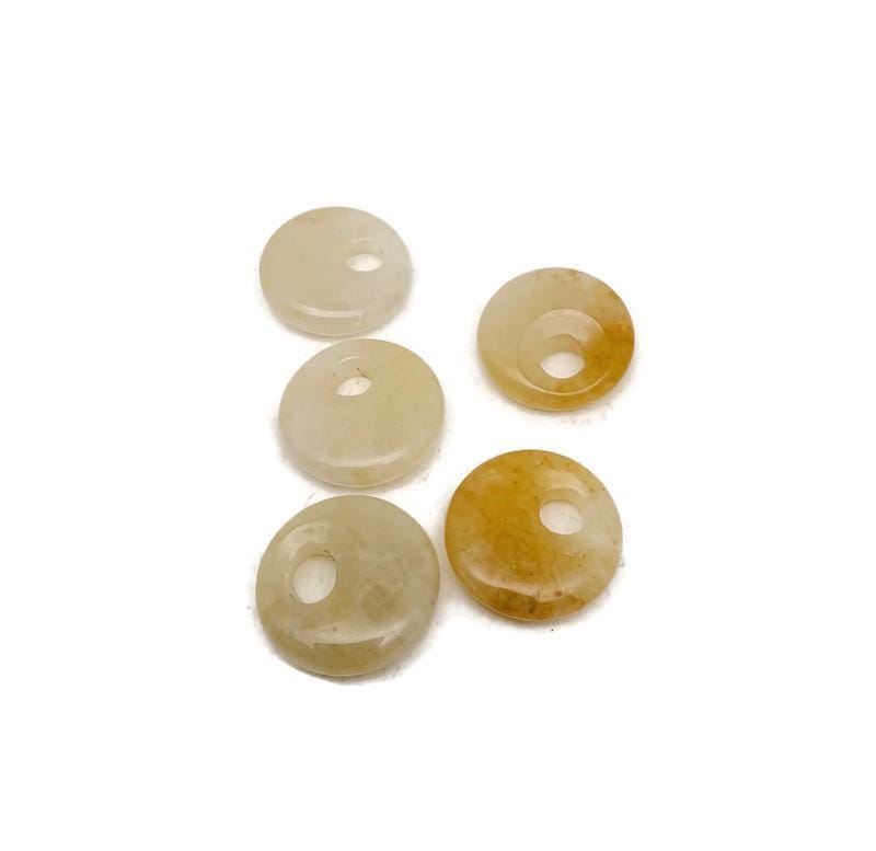 Yellow jade crystal donut pendant from GemstoneGO, 20mm Pi stone with smooth, polished surface and vibrant yellow color.