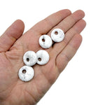 Light gray Howlite crystal donut with natural veining, 20mm Pi stone from GemstoneGO, showcasing smooth, polished surface and unique pattern.