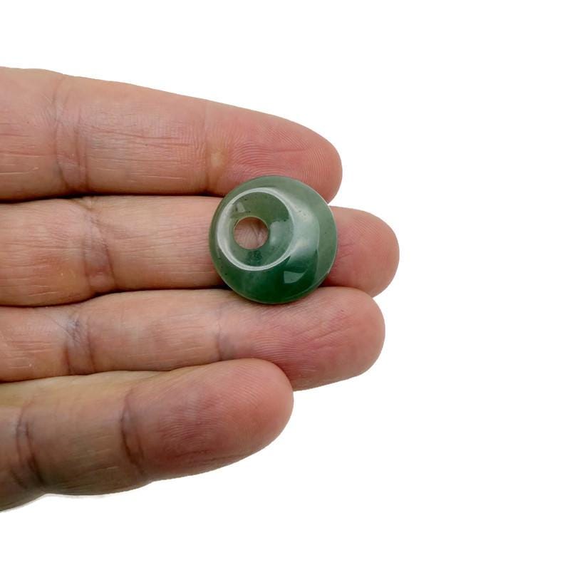 A 20mm aventurine crystal donut pendant with a polished green gemstone, showcasing its smooth, rounded shape and natural stone pattern.