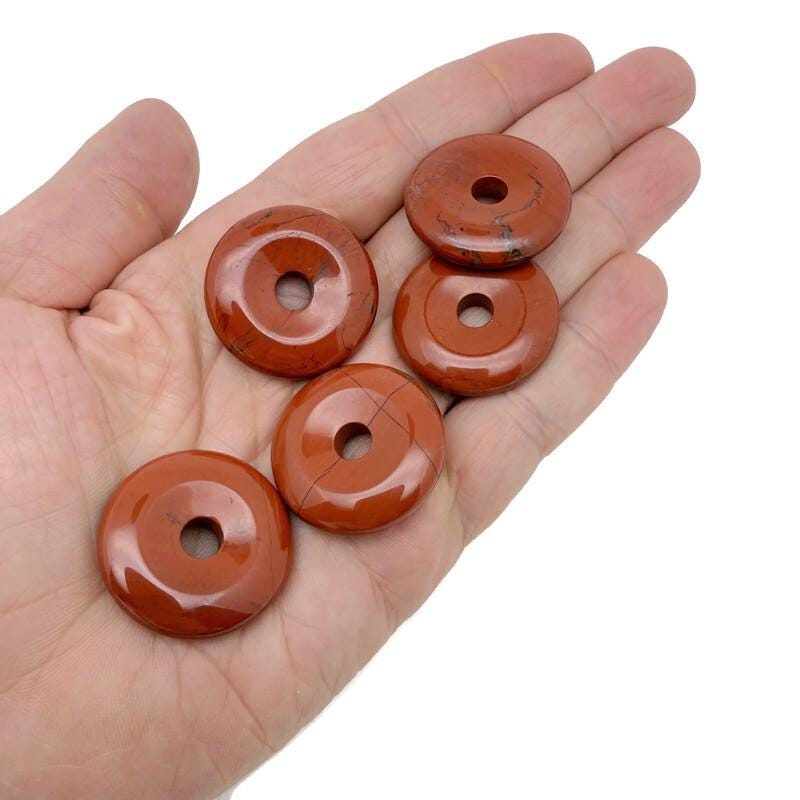 Red Jasper crystal donut from GemstoneGO, 30mm Pi Stone with vibrant red color and smooth polished surface.