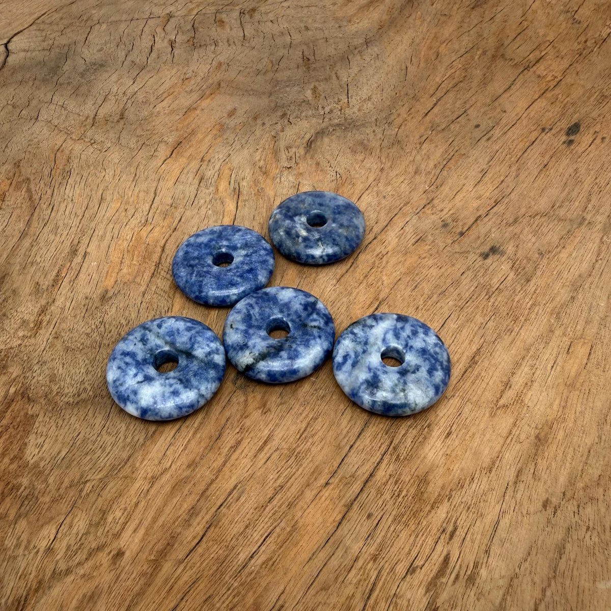 Sodalite crystal donut pendant from GemstoneGO, 30mm Pi Stone with vibrant blue and white natural gemstone pattern.
