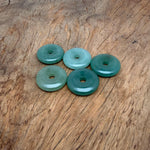 A 30mm aventurine crystal donut gemstone from GemstoneGO, showcasing its green, polished, donut-shaped design with natural stone patterns.