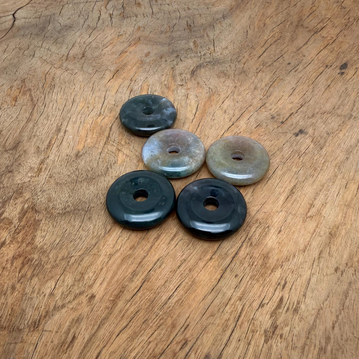 Moss Agate crystal donut pendant with natural green and brown patterns, 30mm diameter, handcrafted gemstone from GemstoneGO.