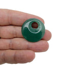 A 30mm aventurine crystal donut pendant from GemstoneGO with a polished, green gemstone and a smooth, circular shape.