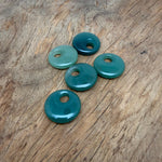 A 30mm aventurine crystal donut pendant with a polished green gemstone, labeled Pi Stone, from GemstoneGO.