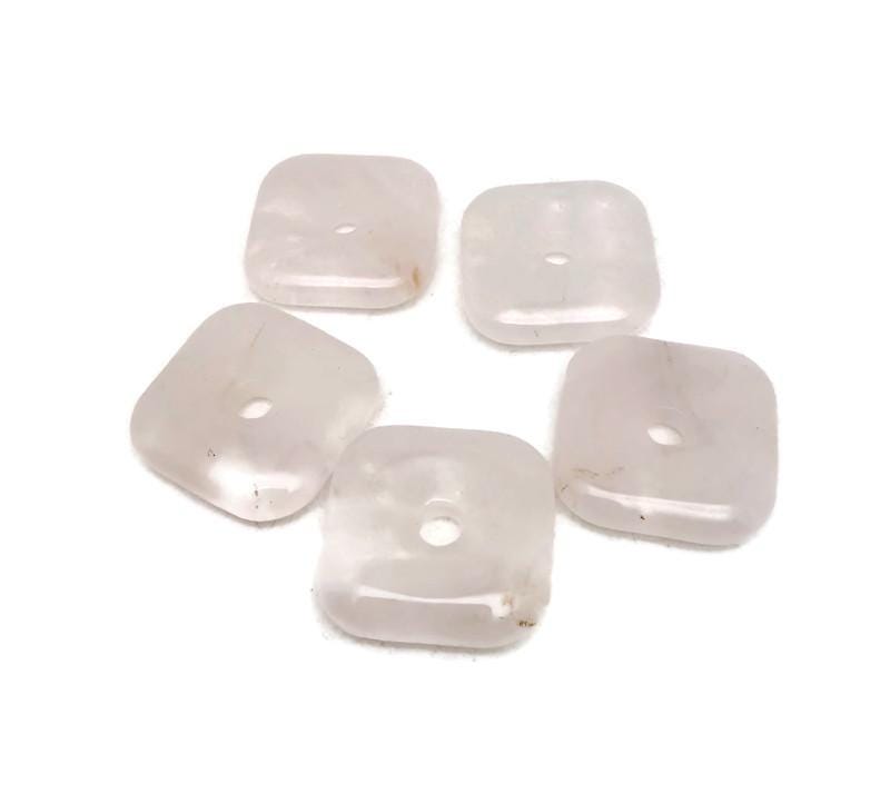 Square rose quartz crystal donut pendant from GemstoneGO, 30mm diameter, showcasing a smooth pink gemstone with polished edges.