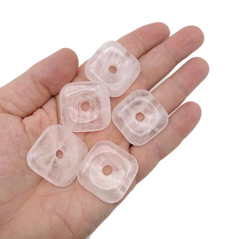 Pink rose quartz square crystal donut pendant, 30mm Pi stone from GemstoneGO, showcasing a polished gemstone with smooth facets.