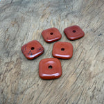 Red Jasper square crystal donut pendant, 30mm Pi stone from GemstoneGO, featuring a polished red jasper gemstone with a smooth square shape.