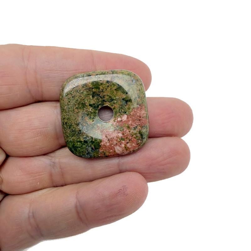 Unakite square crystal donut pendant, 30mm Pi stone by GemstoneGO, showing vibrant green and pink unakite mineral patterns.