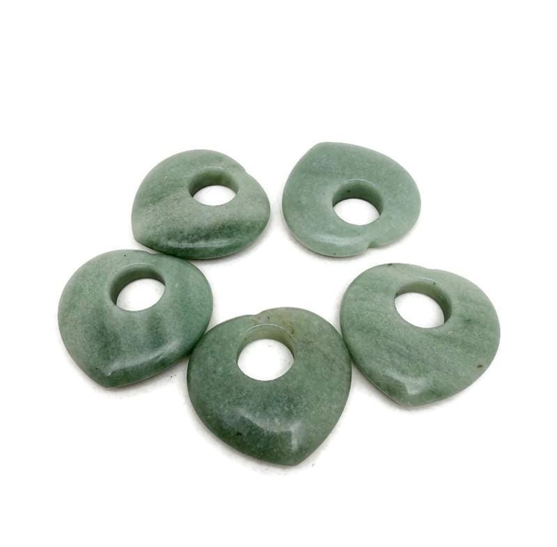 A 40mm aventurine love crystal heart from GemstoneGO, showcasing smooth green gemstone with natural patterns and polished finish.