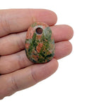 Oval crystal pendant from GemstoneGO, natural stone jewelry making bead with a polished, translucent appearance.