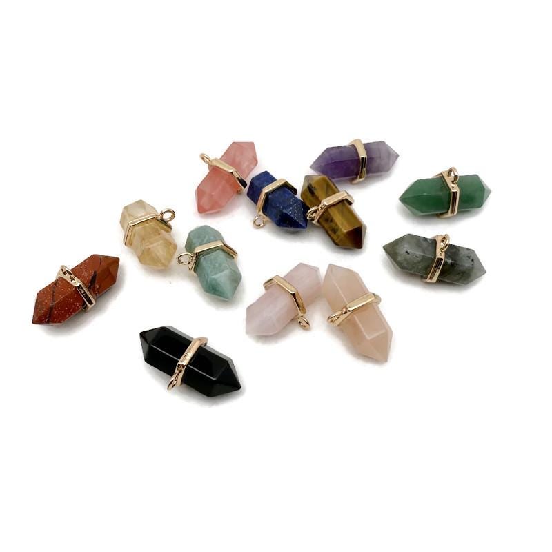 Double terminated natural gemstone pendant by GemstoneGO featuring a clear crystal point with unique mineral markings.
