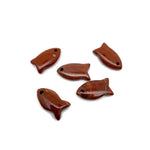 Red Jasper fish-shaped crystal pendant with a healing stone design, featuring a detailed fish charm for jewelry.