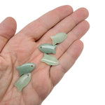 Aventurine fish-shaped crystal pendant with a polished green gemstone charm, designed for jewelry and healing energies.