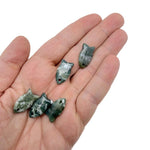 Moss agate fish-shaped crystal pendant with natural green and brown patterns, designed for jewelry and healing stones.
