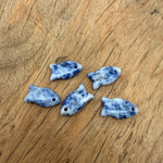 Sodalite fish-shaped crystal pendant with healing stone charm, featuring blue and white mineral patterns, jewelry accessory.