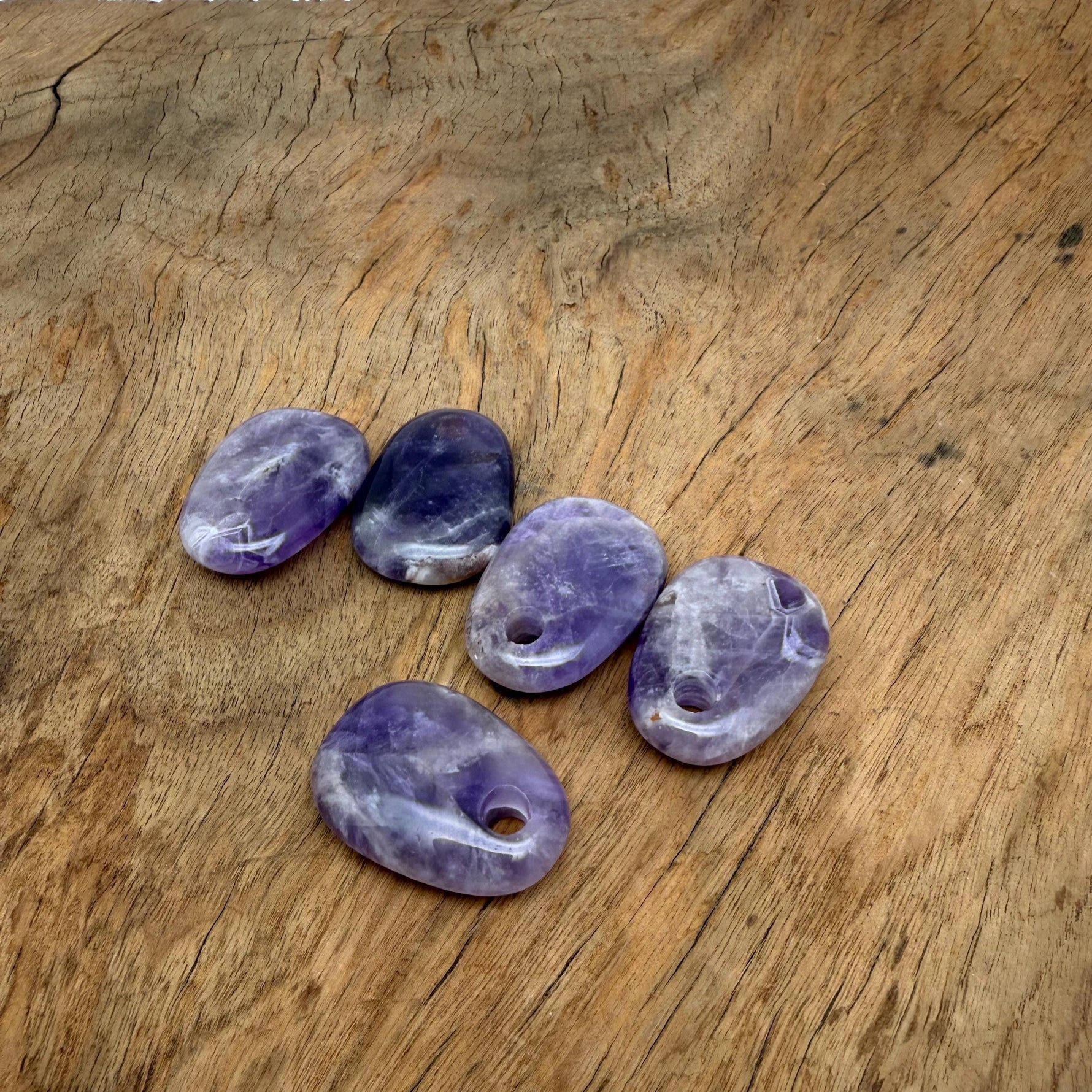Amethyst oval crystal pendant from GemstoneGO, showcasing a polished natural stone bead for jewelry making.