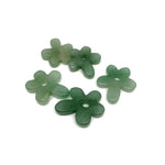 A carved aventurine gemstone flower pendant with a crystal flower charm, featuring intricate details and vibrant green hues.