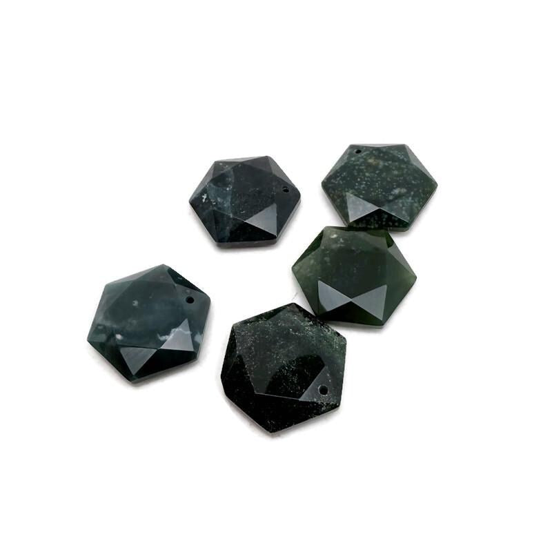 Faceted moss agate hexagon crystal pendant necklace with a polished stone bead, showcasing natural green and brown mineral patterns.