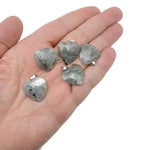 Labradorite faceted heart crystal pendant from GemstoneGO featuring a natural, iridescent gemstone charm on a metal bail.