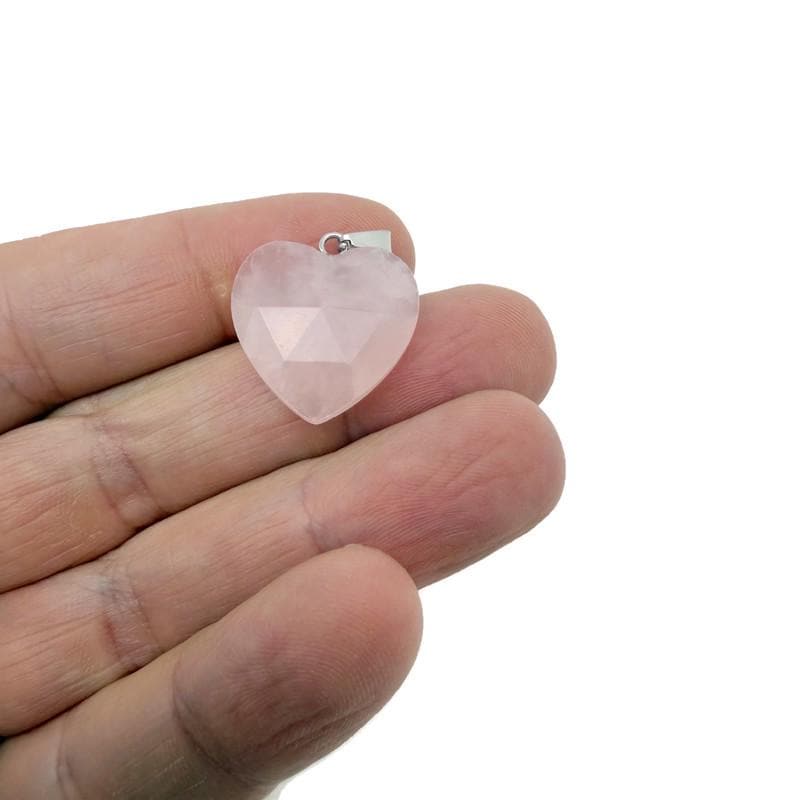 Faceted rose quartz heart crystal pendant from GemstoneGO, natural gemstone charm with a polished, faceted surface.
