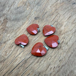 Red Jasper faceted heart crystal pendant by GemstoneGO, showcasing a polished natural red jasper heart charm with a gemstone loop.