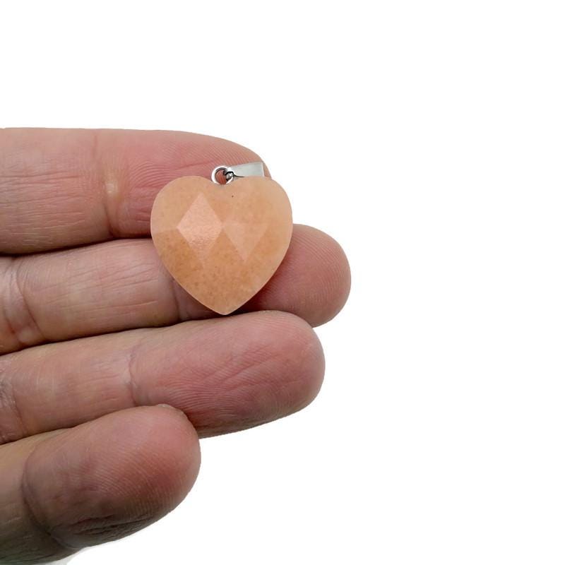 Orange aventurine faceted heart crystal pendant by GemstoneGO featuring a natural crystal charm with faceted surface.