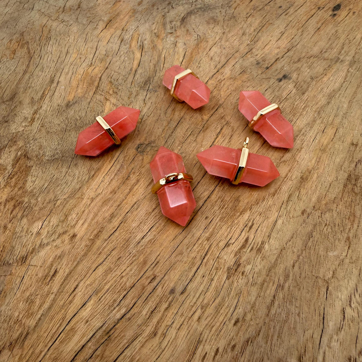 Cherry Quartz double terminated crystal pendant featuring a natural gemstone point with vibrant red hues, ideal for jewelry and healing.