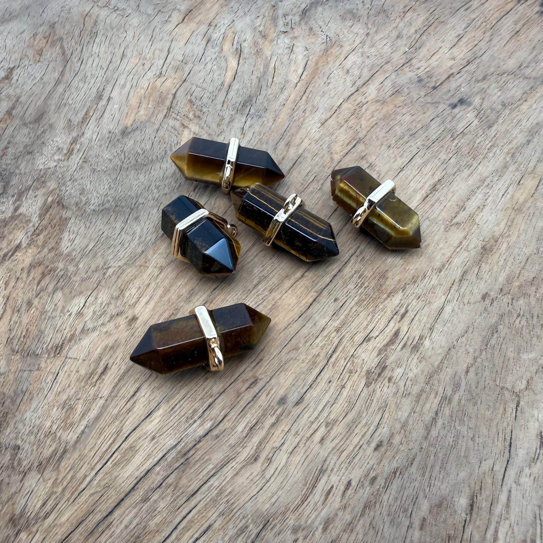 Tiger Eye double terminated crystal pendant featuring a natural gemstone point from GemstoneGO.