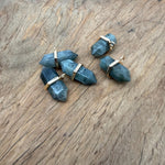 Labradorite double terminated crystal pendant with natural gemstone point, showcasing iridescent colors and polished surface.