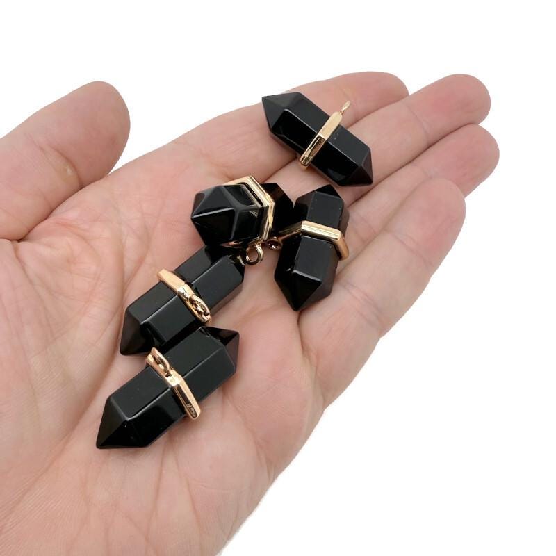 Natural obsidian double terminated crystal pendant with a pointed gemstone tip, showcasing smooth, polished black stone from GemstoneGO.