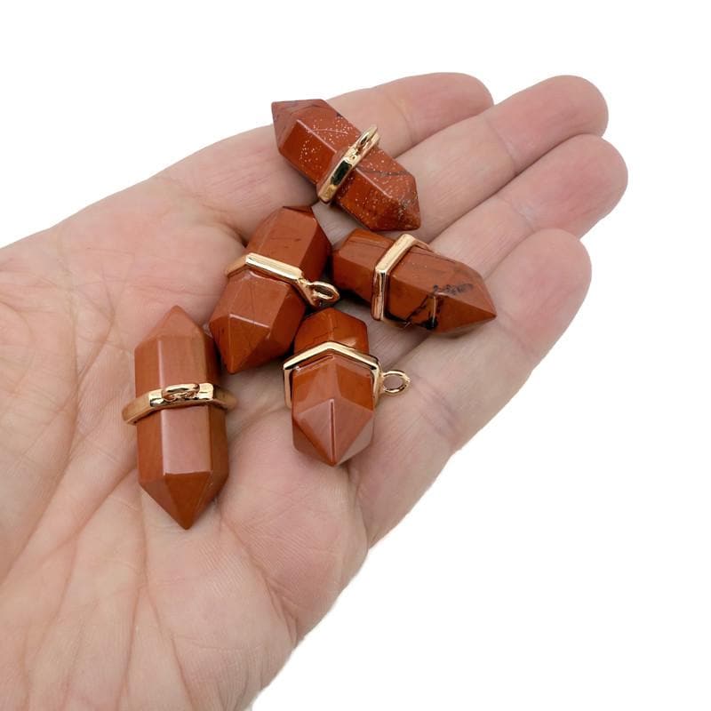 Red Jasper double terminated crystal pendant with natural gemstone point, showcasing vibrant red color and polished surface.
