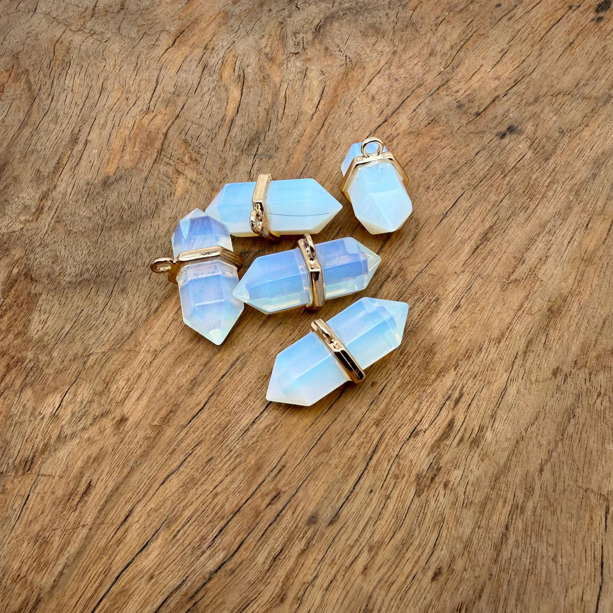 Opalite double terminated crystal pendant from GemstoneGO, showcasing a natural gemstone point with smooth, polished surfaces.