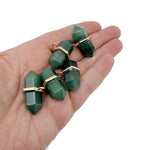 Aventurine double terminated crystal pendant with natural green gemstone point, showcasing a polished, pointed crystal with gold wire wrapping.