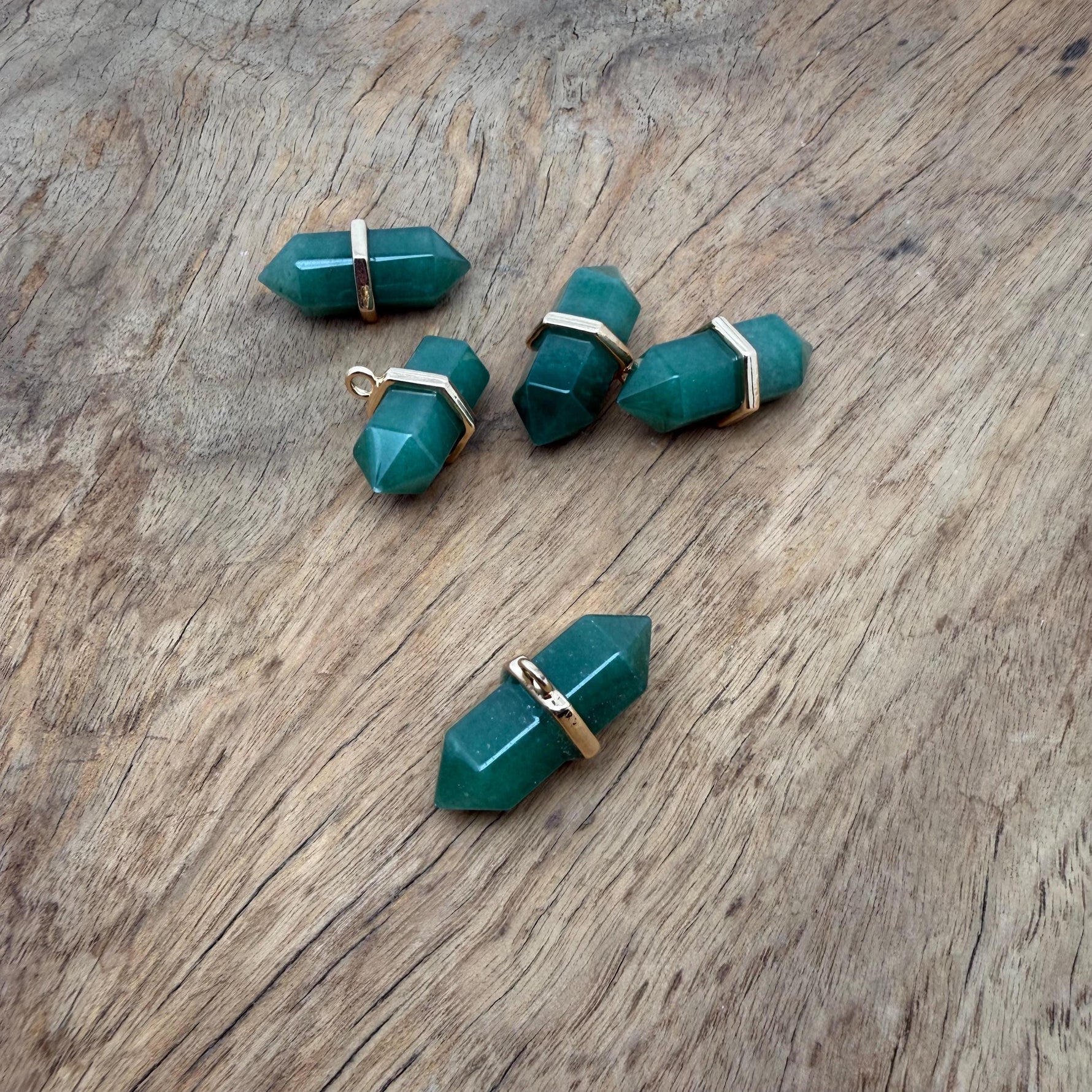 Aventurine double terminated crystal pendant from GemstoneGO, showcasing a natural green gemstone point with polished surfaces.